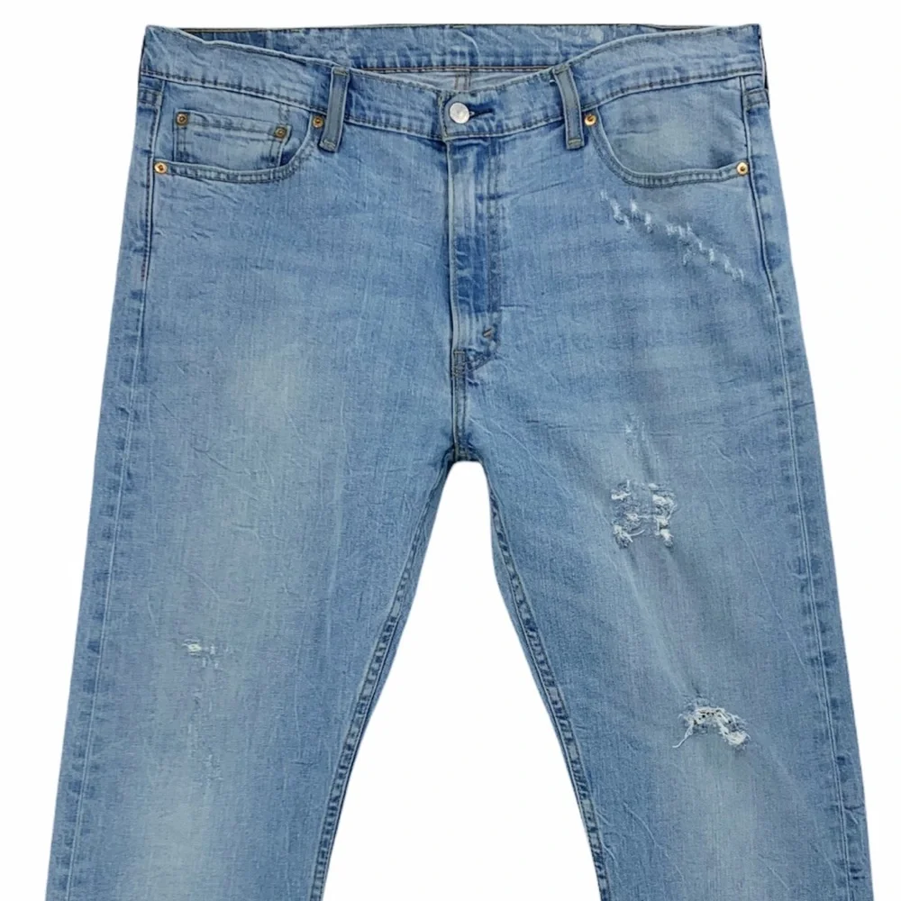 Levi’s 513 Slim Straight Distressed Light Wash Jeans